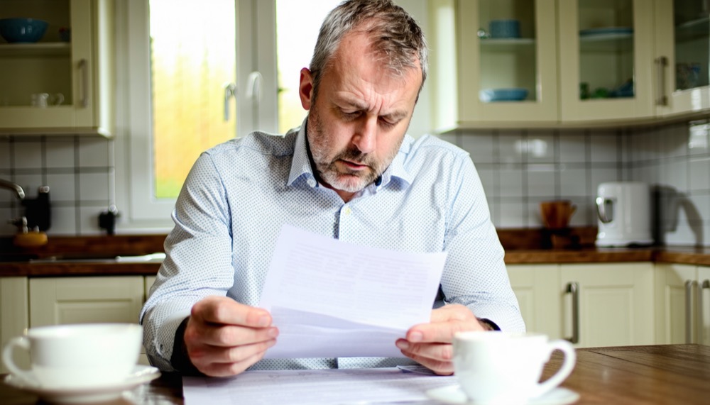 Person reading redundancy letter